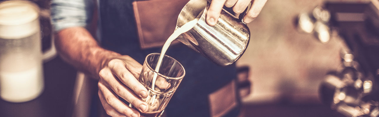 Barista pouring coffee