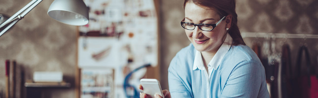 Female business owner using phone